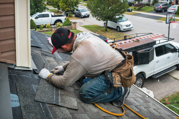 Professional Roofing technician working in Chelmsford, MA
